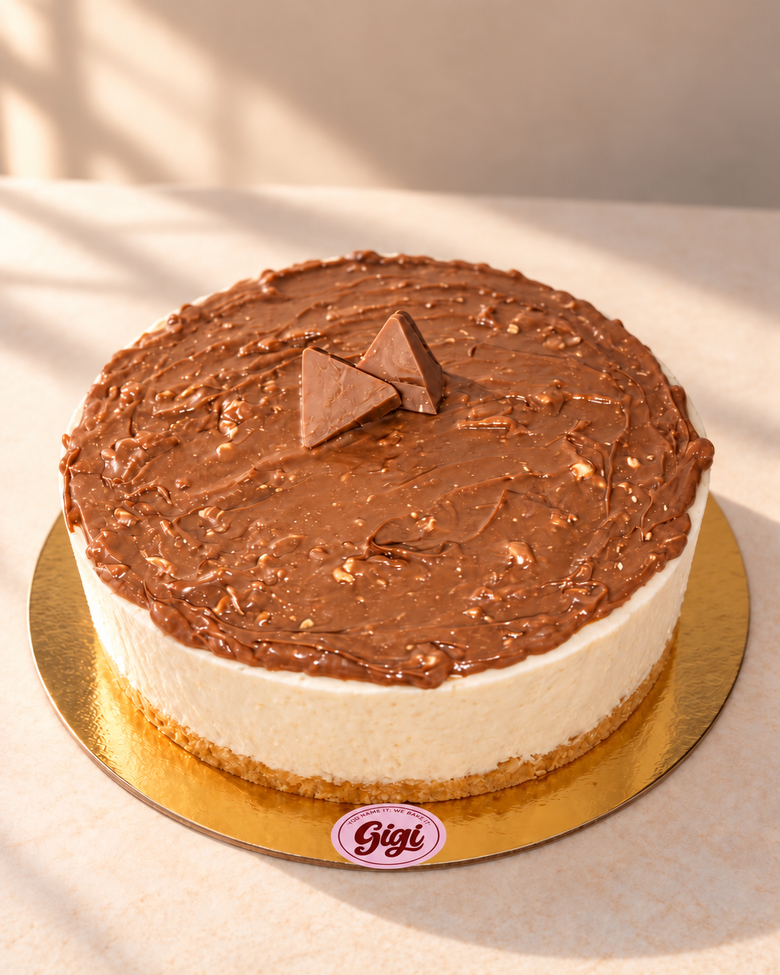 Gigi Toblerone cheesecake on a gold cake board