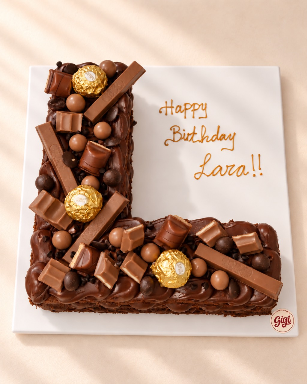 Chocolate-topped initial birthday cake