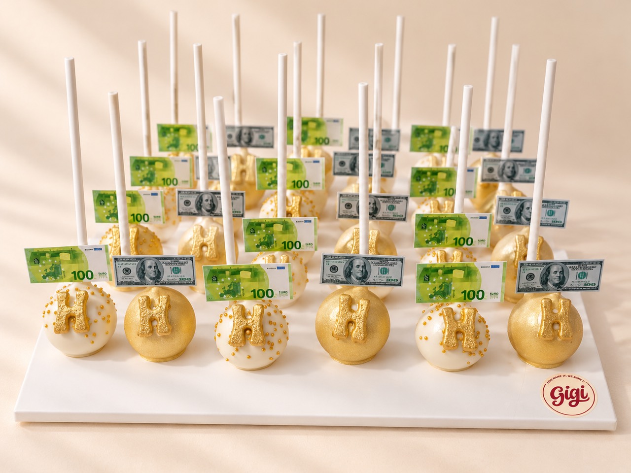 Personalized gold and white cake pops