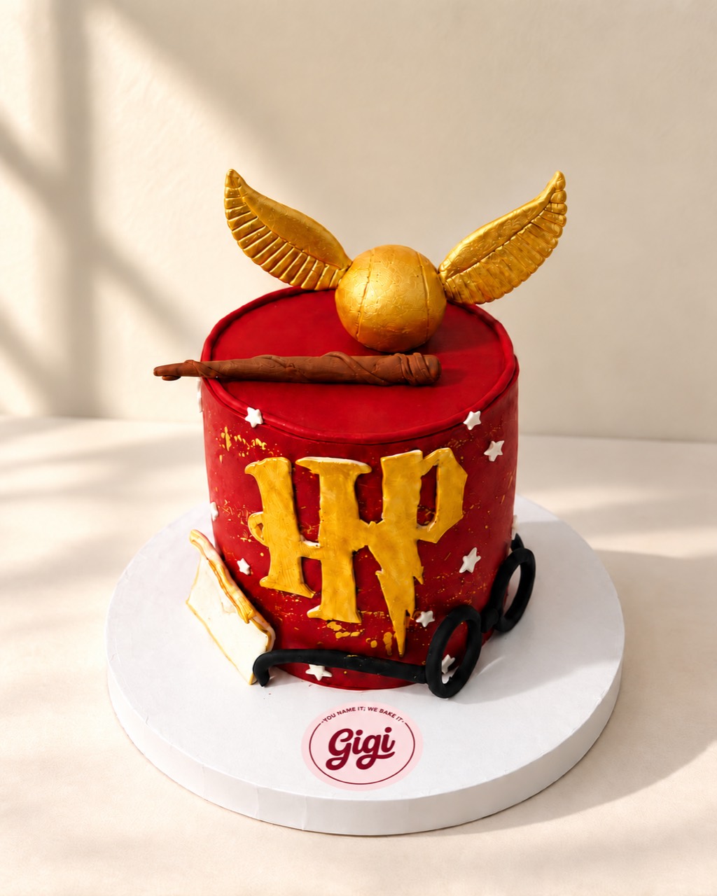 Red and gold wizard-inspired cake